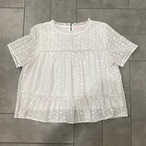 Medium. White eyelet shirt with high collar and keyhole back